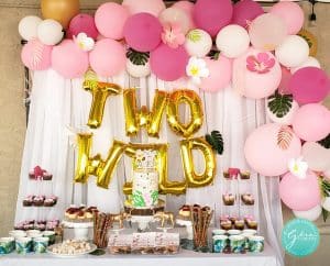 tropical pink and gols dessert table balloon garland two wild